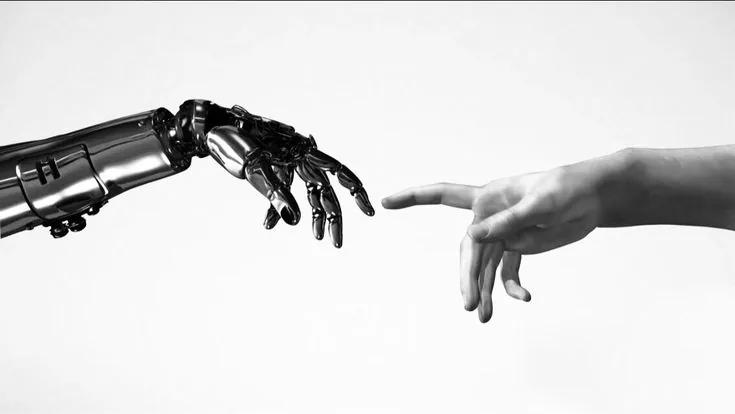 Robotic hand reaching toward a human hand